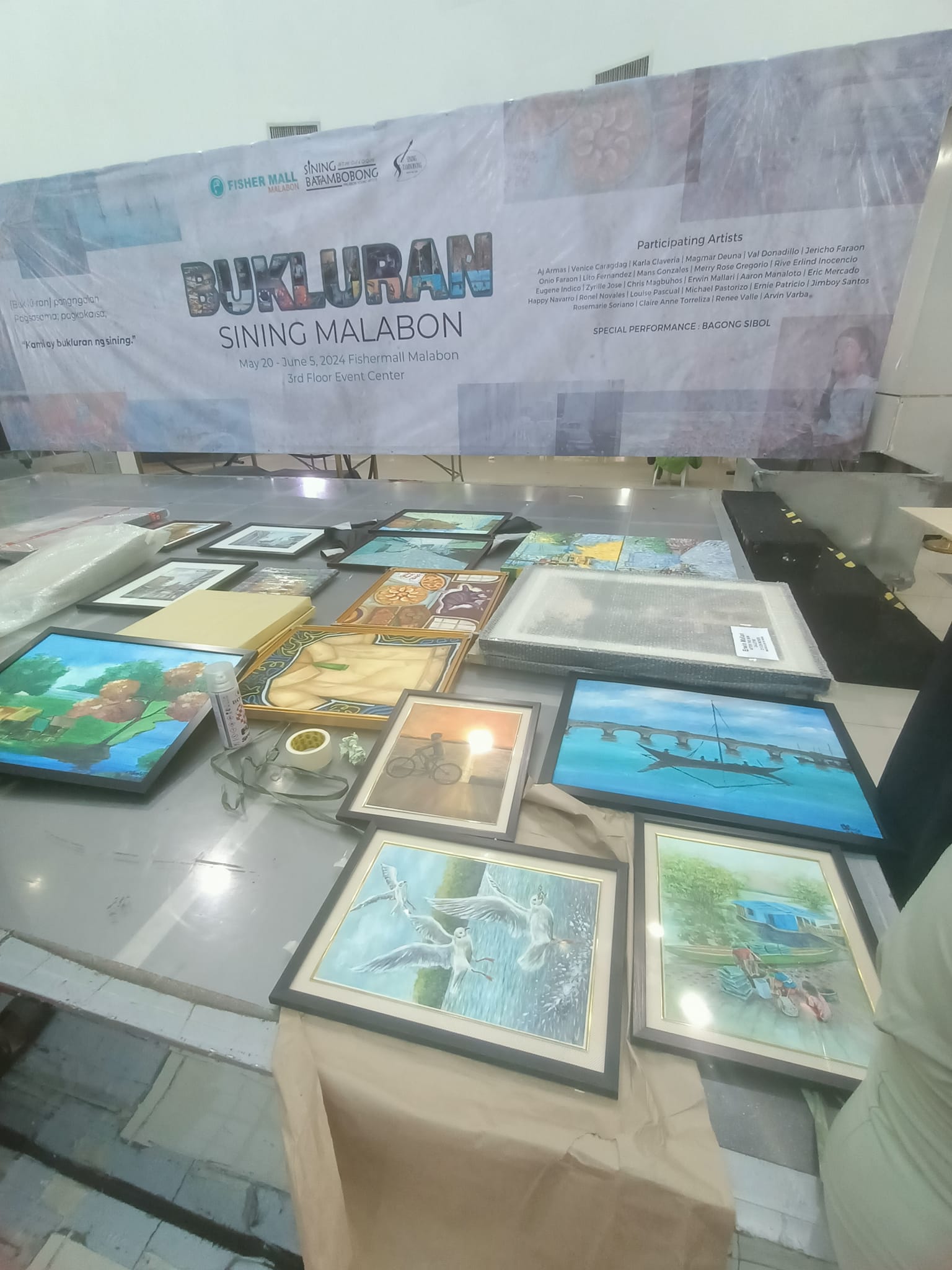 Setting up the gallery and arranging the artworks